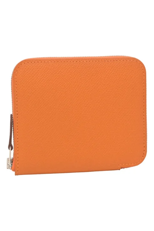 Orange Epsom leather Silk'In change purse featuring Henri d'Origny's 'Mors &amp; Co' printed lining