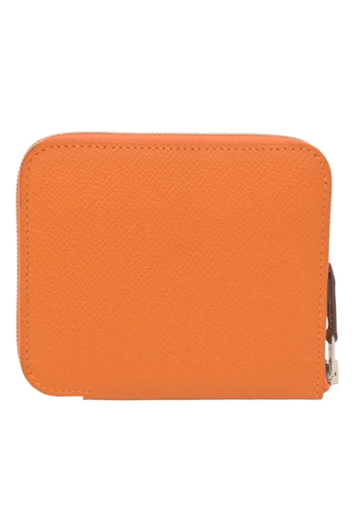 Orange Epsom leather Silk'In change purse featuring Henri d'Origny's 'Mors &amp; Co' printed lining