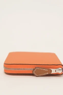Orange Epsom leather Silk'In change purse featuring Henri d'Origny's 'Mors &amp; Co' printed lining