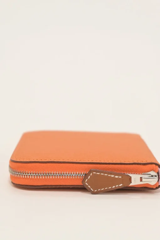 Orange Epsom leather Silk'In change purse featuring Henri d'Origny's 'Mors &amp; Co' printed lining