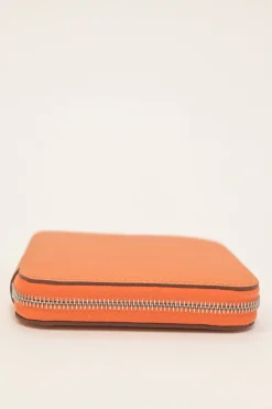 Orange Epsom leather Silk'In change purse featuring Henri d'Origny's 'Mors &amp; Co' printed lining