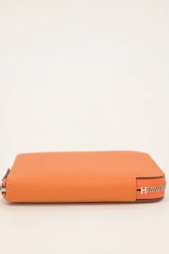 Orange Epsom leather Silk'In change purse featuring Henri d'Origny's 'Mors &amp; Co' printed lining