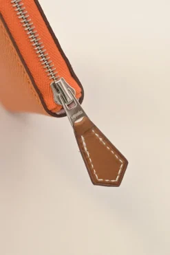 Orange Epsom leather Silk'In change purse featuring Henri d'Origny's 'Mors &amp; Co' printed lining