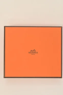 Orange Epsom leather Silk'In change purse featuring Henri d'Origny's 'Mors &amp; Co' printed lining