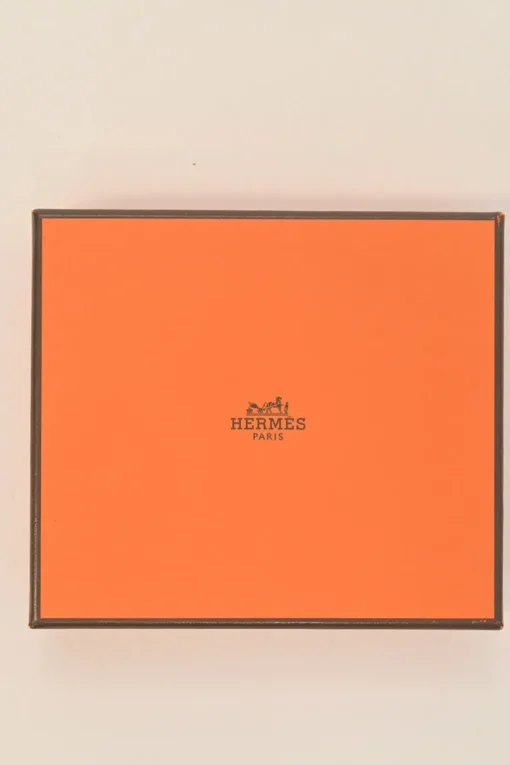 Orange Epsom leather Silk'In change purse featuring Henri d'Origny's 'Mors &amp; Co' printed lining
