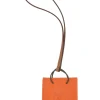 Orange Feu Milo and gold Swift shopping bag charm