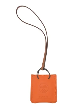 Orange Feu Milo and gold Swift shopping bag charm