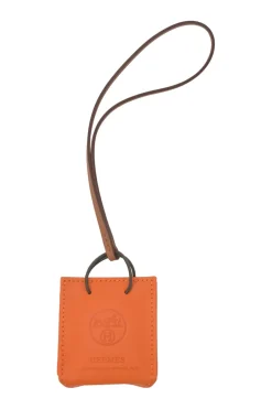 Orange Feu Milo and gold Swift shopping bag charm