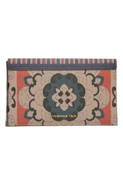 Orange grained printed leather turnlock flap envelope clutch featuring painterly floral motif