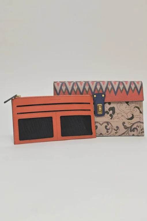 Orange grained printed leather turnlock flap envelope clutch featuring painterly floral motif
