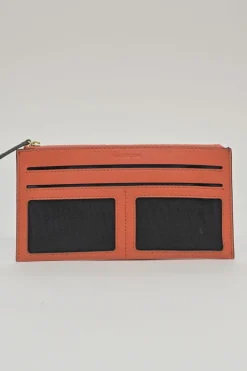 Orange grained printed leather turnlock flap envelope clutch featuring painterly floral motif