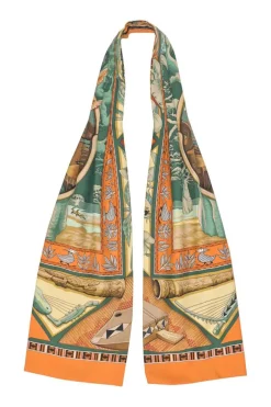 Orange silk 'Au Son du Tam-Tam' printed scarf featuring original artwork by Laurence "Toutsy" Bourthoumieux