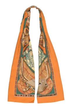Orange silk 'Au Son du Tam-Tam' printed scarf featuring original artwork by Laurence "Toutsy" Bourthoumieux