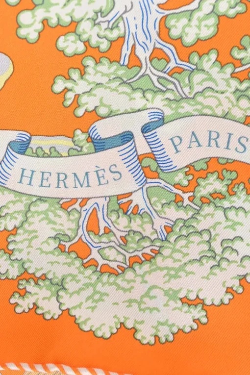 Orange silk 'Sur Mon Nuage' square scarf featuring original artwork by Dimitri Rybaltchenko