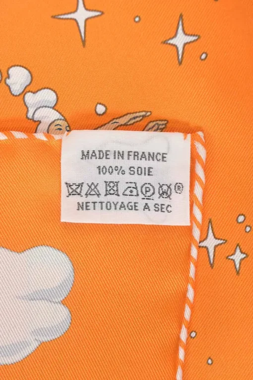 Orange silk 'Sur Mon Nuage' square scarf featuring original artwork by Dimitri Rybaltchenko