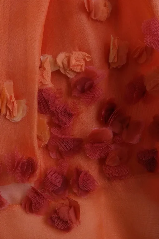Orange viscose-blend mixed media semi-sheer button-front cardigan with back floral appliqués