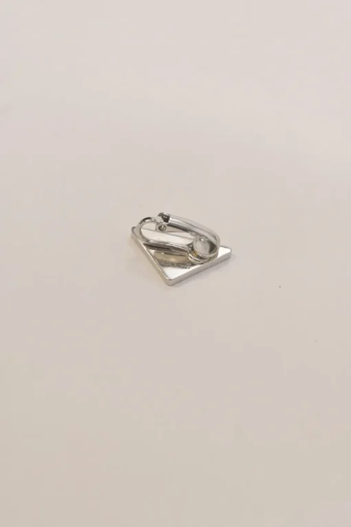 Palladium-plated silver and yellow enamel logo triangle-shaped Symbole clip-back single earring