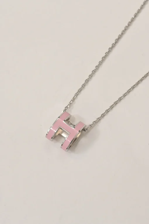 Palladium-plated silver-tone metal and pink enamel Pop H solitaire pendant necklace with lobster clasp closure