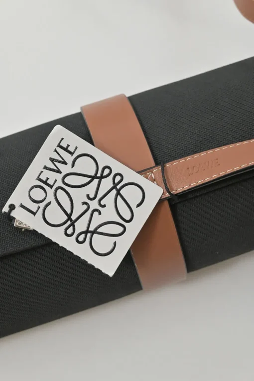 Paula's Ibiza 'The Combo' black micro fiber-covered rubber yoga mat featuring novelty parrot motif