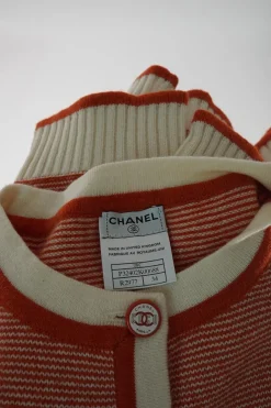 Peach cashmere striped weft knit half-sleeve cardigan with Coco Mark shank buttons