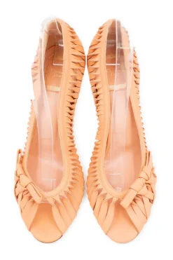 Peach open toed heels with twisted pattern on the sides