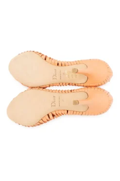 Peach open toed heels with twisted pattern on the sides