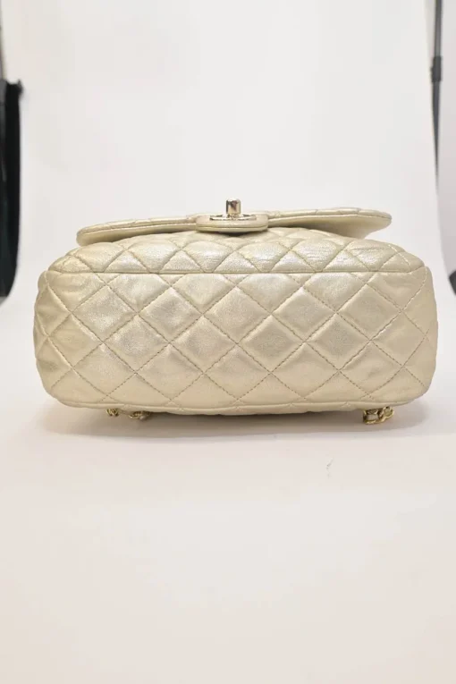 Pearl gold foiled matelassé lambskin drawstring In Seoul backpack with chainlink straps