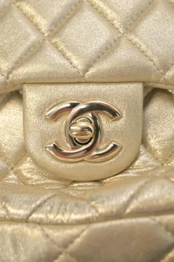 Pearl gold foiled matelassé lambskin drawstring In Seoul backpack with chainlink straps