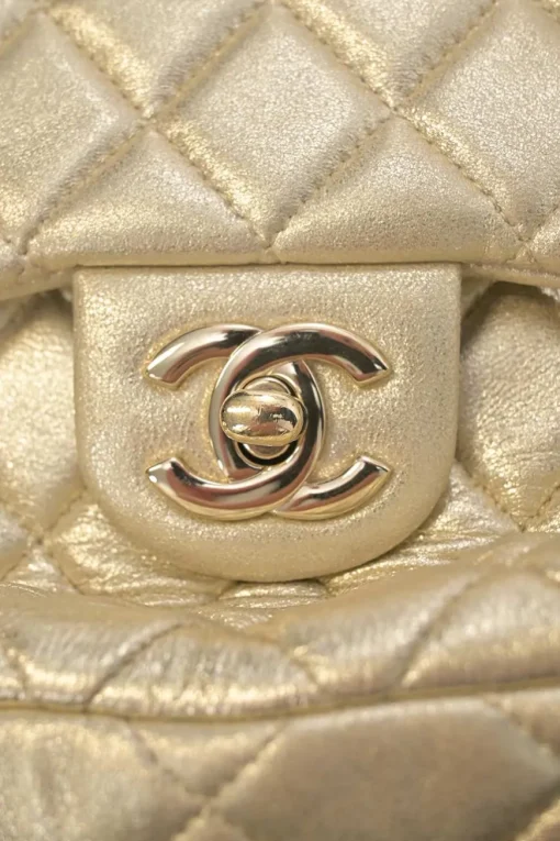 Pearl gold foiled matelassé lambskin drawstring In Seoul backpack with chainlink straps