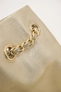 Pearl gold foiled matelassé lambskin drawstring In Seoul backpack with chainlink straps