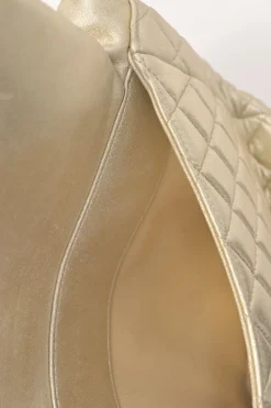 Pearl gold foiled matelassé lambskin drawstring In Seoul backpack with chainlink straps