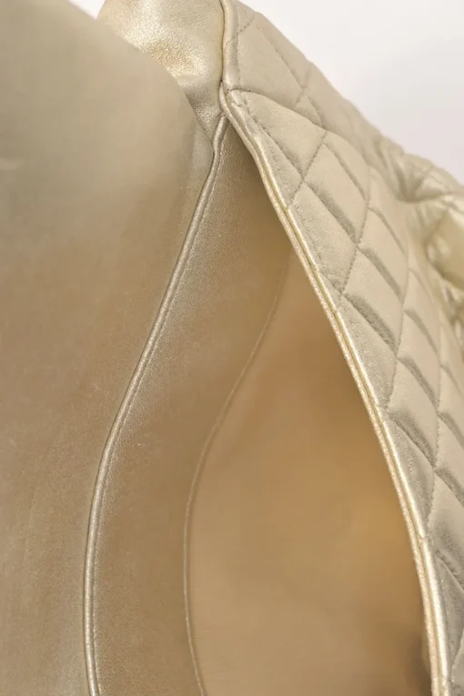 Pearl gold foiled matelassé lambskin drawstring In Seoul backpack with chainlink straps