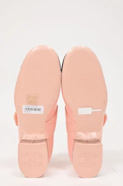 Pink and black patent leather square-toe Mary Jane pumps with Coco Mark instep strap and mirrored stacked heels