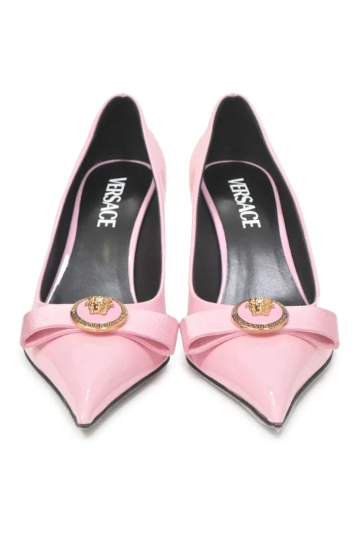 Pink patent leather sharp-point toe Gianni Bow 110 stiletto pumps featuring signature Nastro Gianni bow with enameled Medusa hardware
