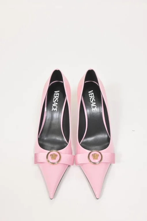 Pink patent leather sharp-point toe Gianni Bow 110 stiletto pumps featuring signature Nastro Gianni bow with enameled Medusa hardware