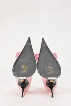 Pink patent leather sharp-point toe Gianni Bow 110 stiletto pumps featuring signature Nastro Gianni bow with enameled Medusa hardware
