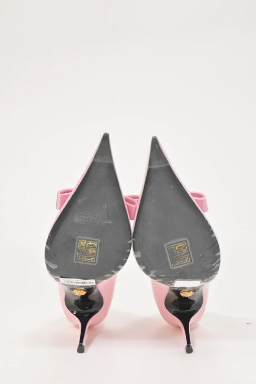 Pink patent leather sharp-point toe Gianni Bow 110 stiletto pumps featuring signature Nastro Gianni bow with enameled Medusa hardware