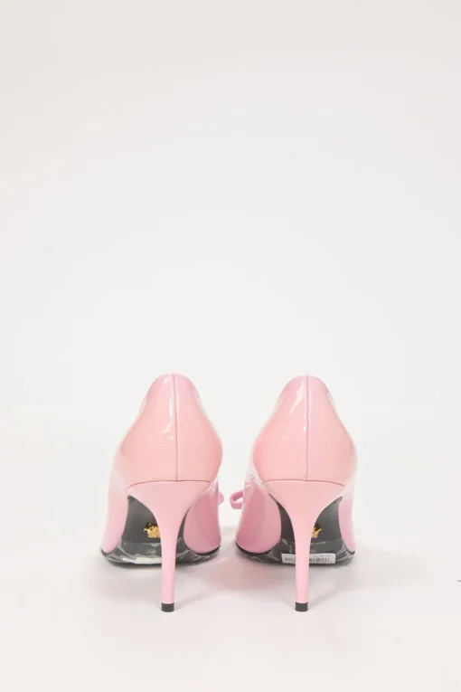 Pink patent leather sharp-point toe Gianni Bow 110 stiletto pumps featuring signature Nastro Gianni bow with enameled Medusa hardware