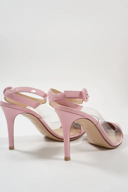 Pink polished calfskin and PVC pointed toe plexi slingback pumps with wraparound buckle ankle strap