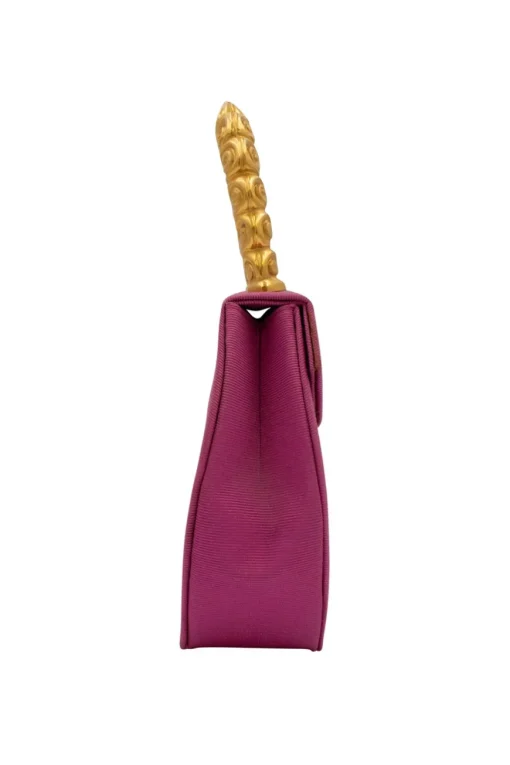 Pink structured mini handbag with solid gold handle imprinted swirls