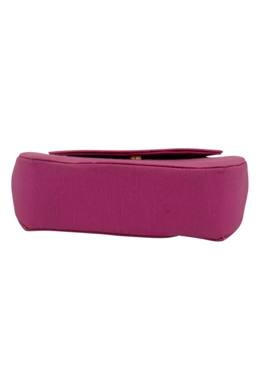 Pink structured mini handbag with solid gold handle imprinted swirls