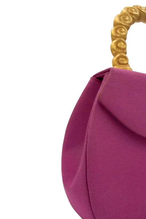 Pink structured mini handbag with solid gold handle imprinted swirls