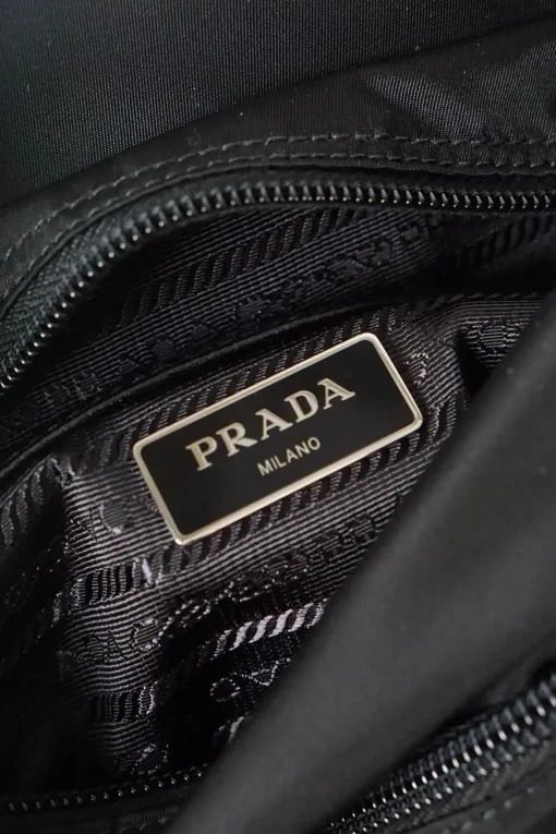 Prada black nylon medium vela flap messenger bag with silver tone studded leather