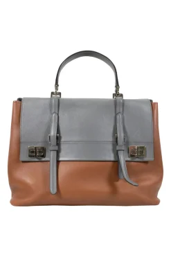 Prada single top handle bag in camel with contrasting grey flap.