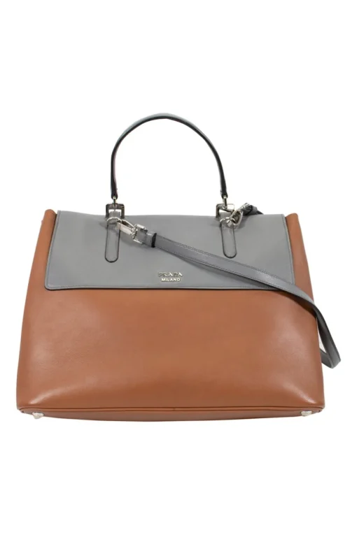 Prada single top handle bag in camel with contrasting grey flap.