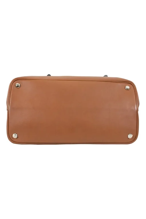 Prada single top handle bag in camel with contrasting grey flap.
