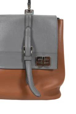 Prada single top handle bag in camel with contrasting grey flap.
