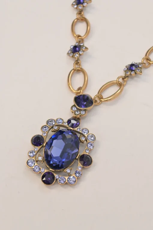 Purple crystal gem-embellished brass necklace and clip-back drop earring costume jewellery set
