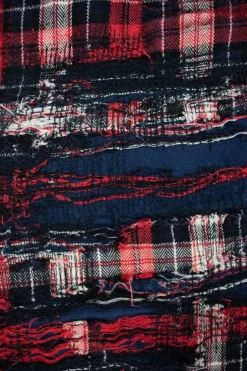 Red, black and white plaid check skinny pants with distressed details
