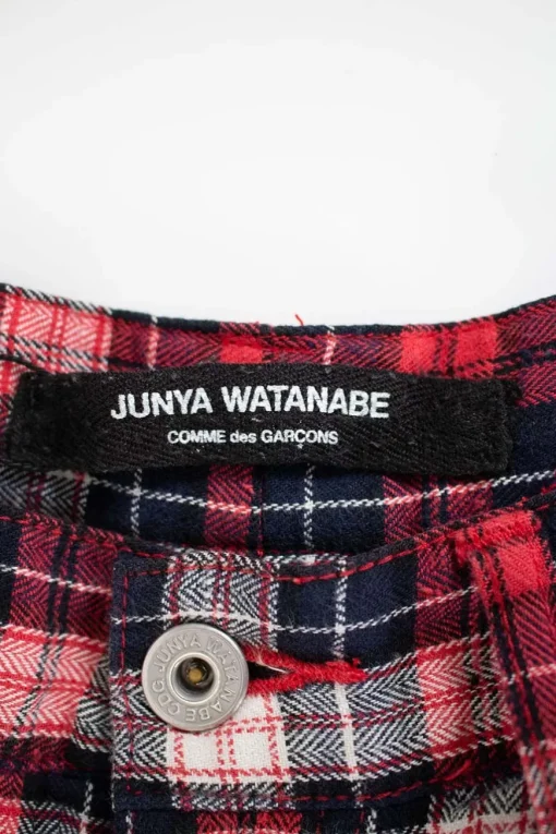 Red, black and white plaid check skinny pants with distressed details